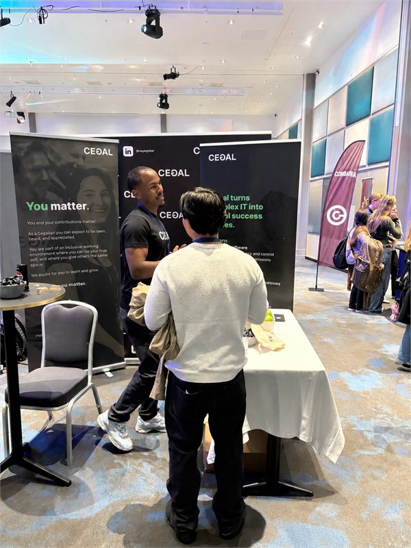 Nhat-Huy talking with a recruiter at a career fair